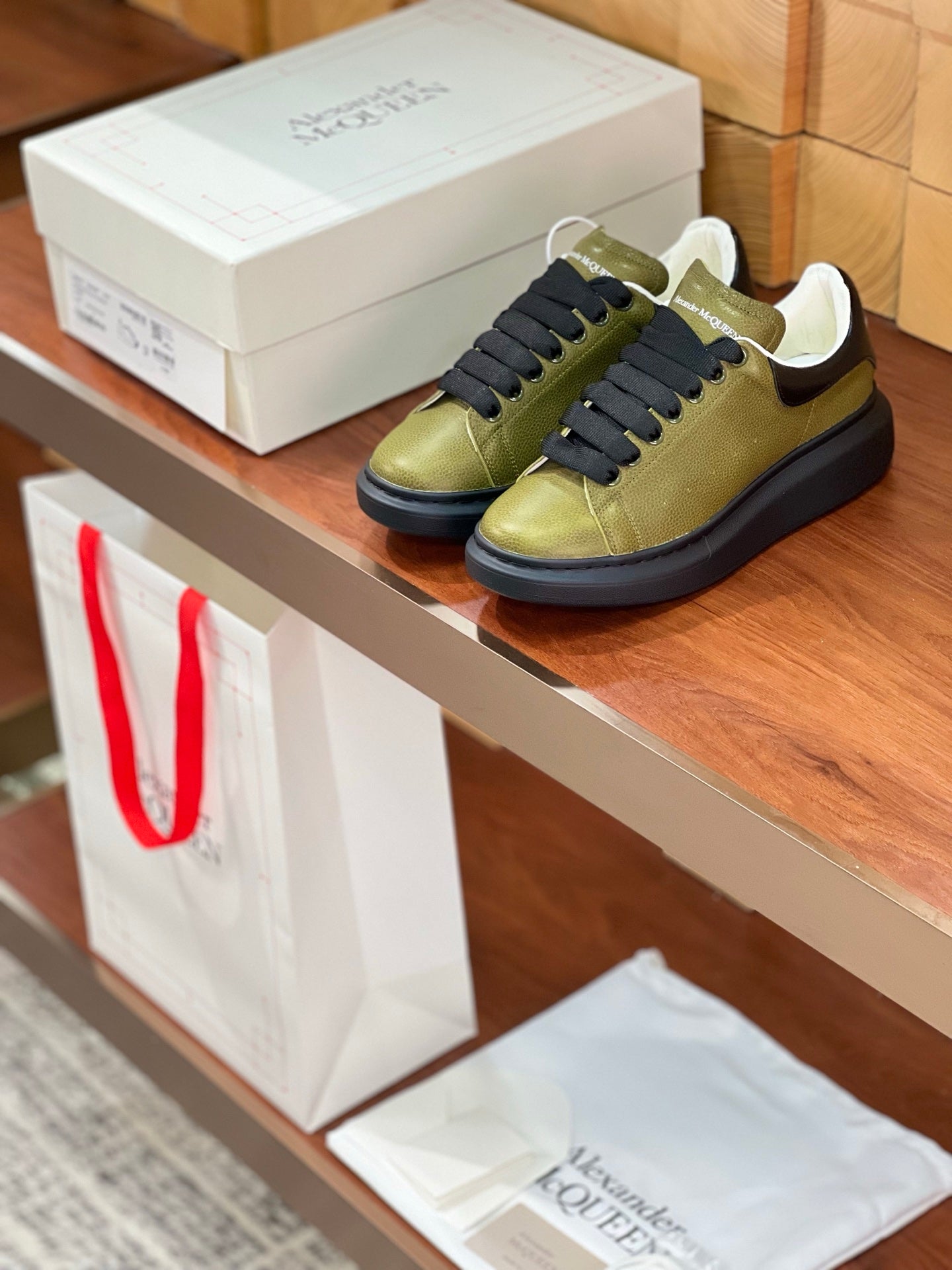 OVERSIZED SNEAKERS IN ARMY GREEN CALFSKIN