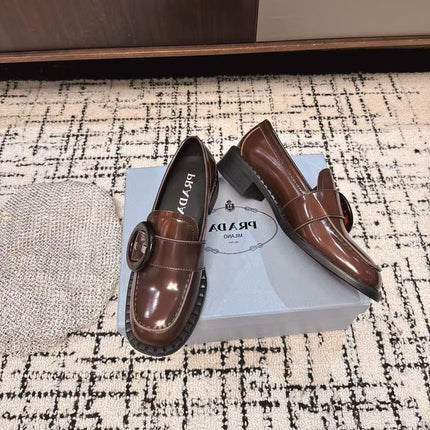 PRADA 26S BUCKLED LOAFERS IN DARK BROWN SHINY CALFSKIN
