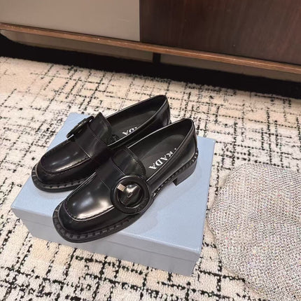 PRADA 26S BUCKLED LOAFERS IN BLACK SHINY CALFSKIN