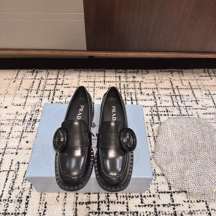 PRADA 26S BUCKLED LOAFERS IN BLACK SHINY CALFSKIN