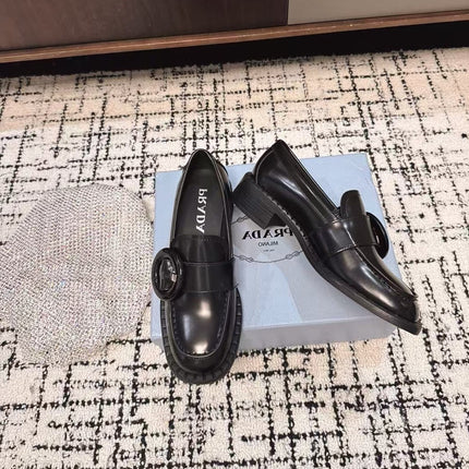 PRADA 26S BUCKLED LOAFERS IN BLACK SHINY CALFSKIN