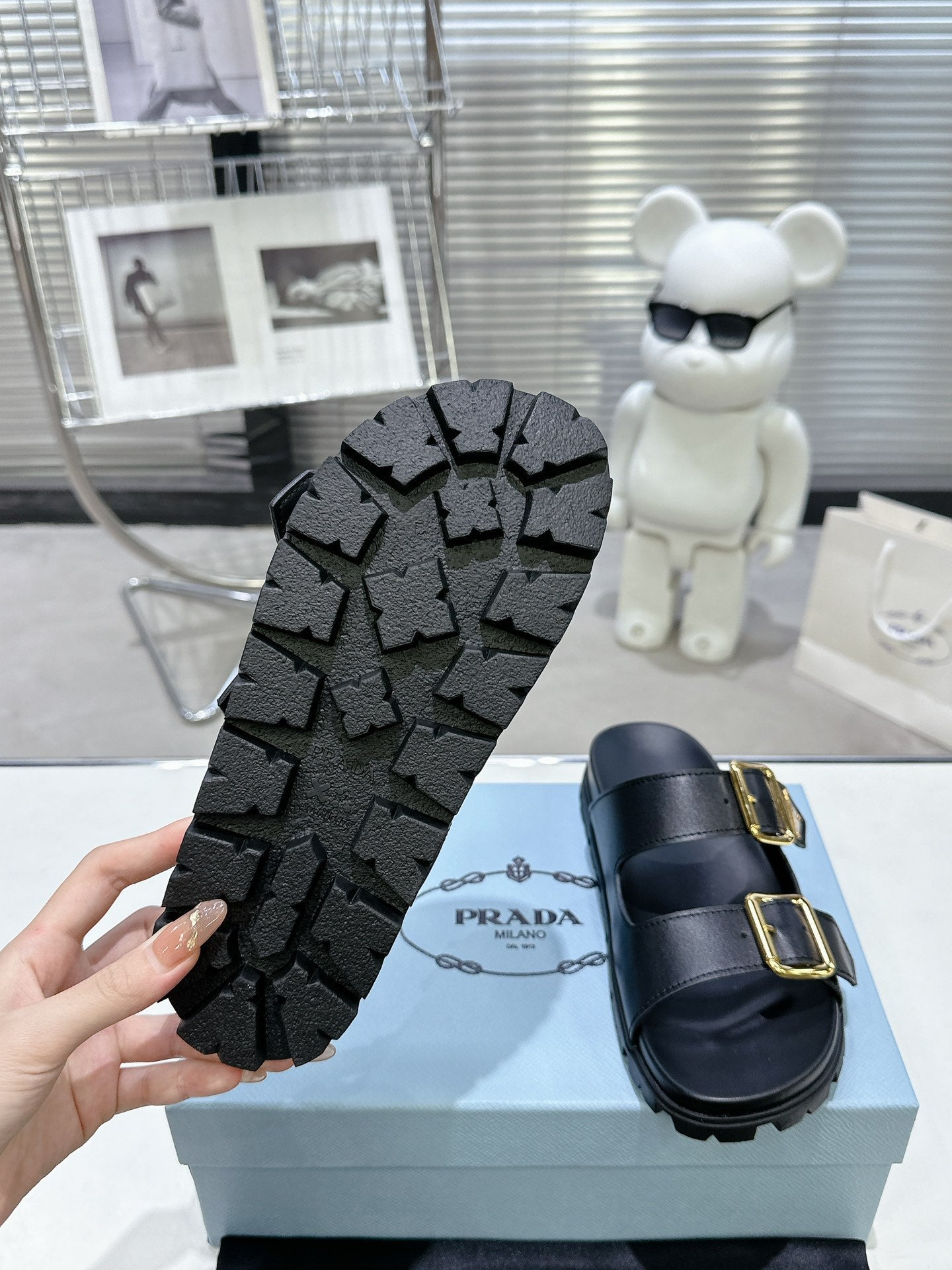 PRADA 25S STRAP SLIDES 30MM IN BLACK CALFSKIN GOLD HARDWARE