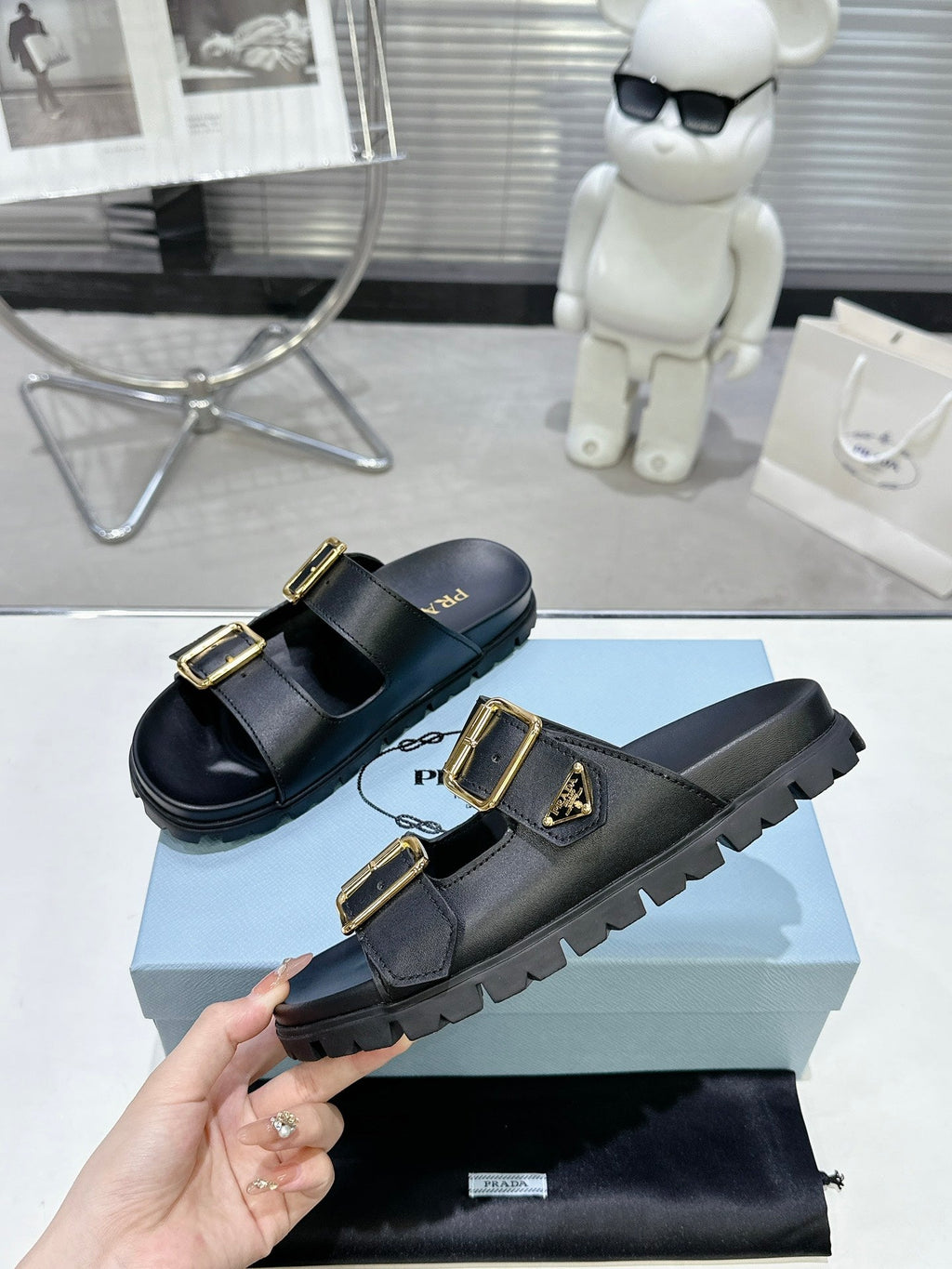 PRADA 25S STRAP SLIDES 30MM IN BLACK CALFSKIN GOLD HARDWARE