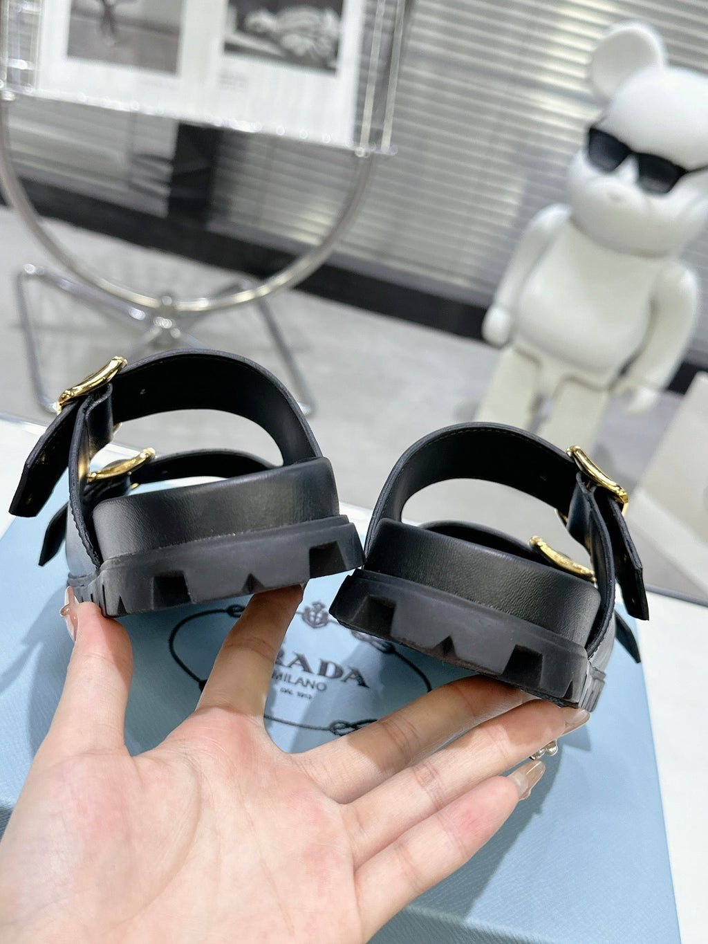 PRADA 25S STRAP SLIDES 30MM IN BLACK CALFSKIN GOLD HARDWARE