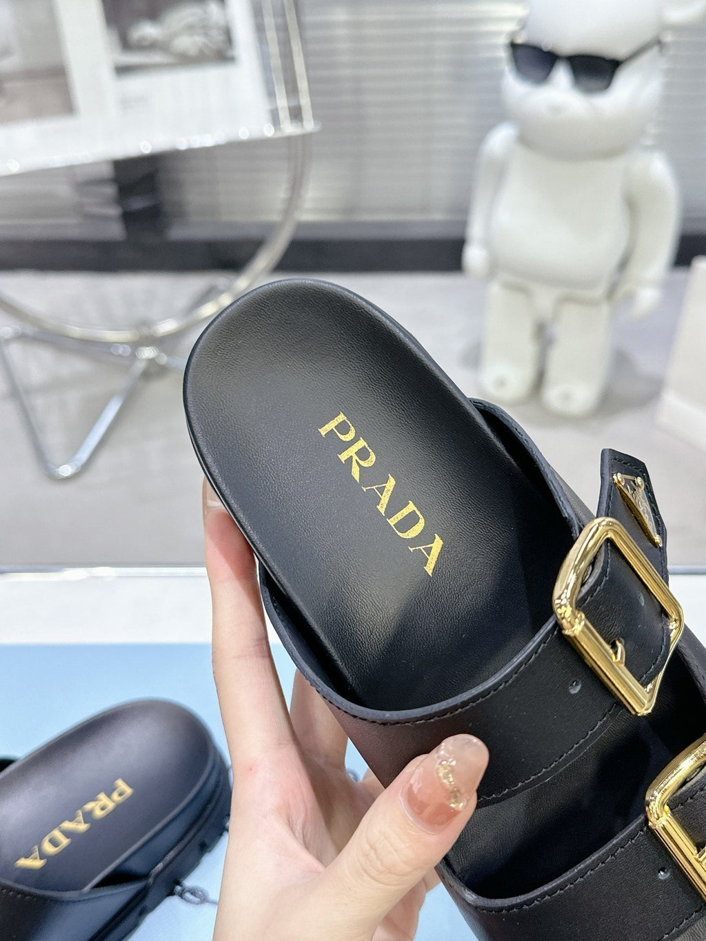 PRADA 25S STRAP SLIDES 30MM IN BLACK CALFSKIN GOLD HARDWARE