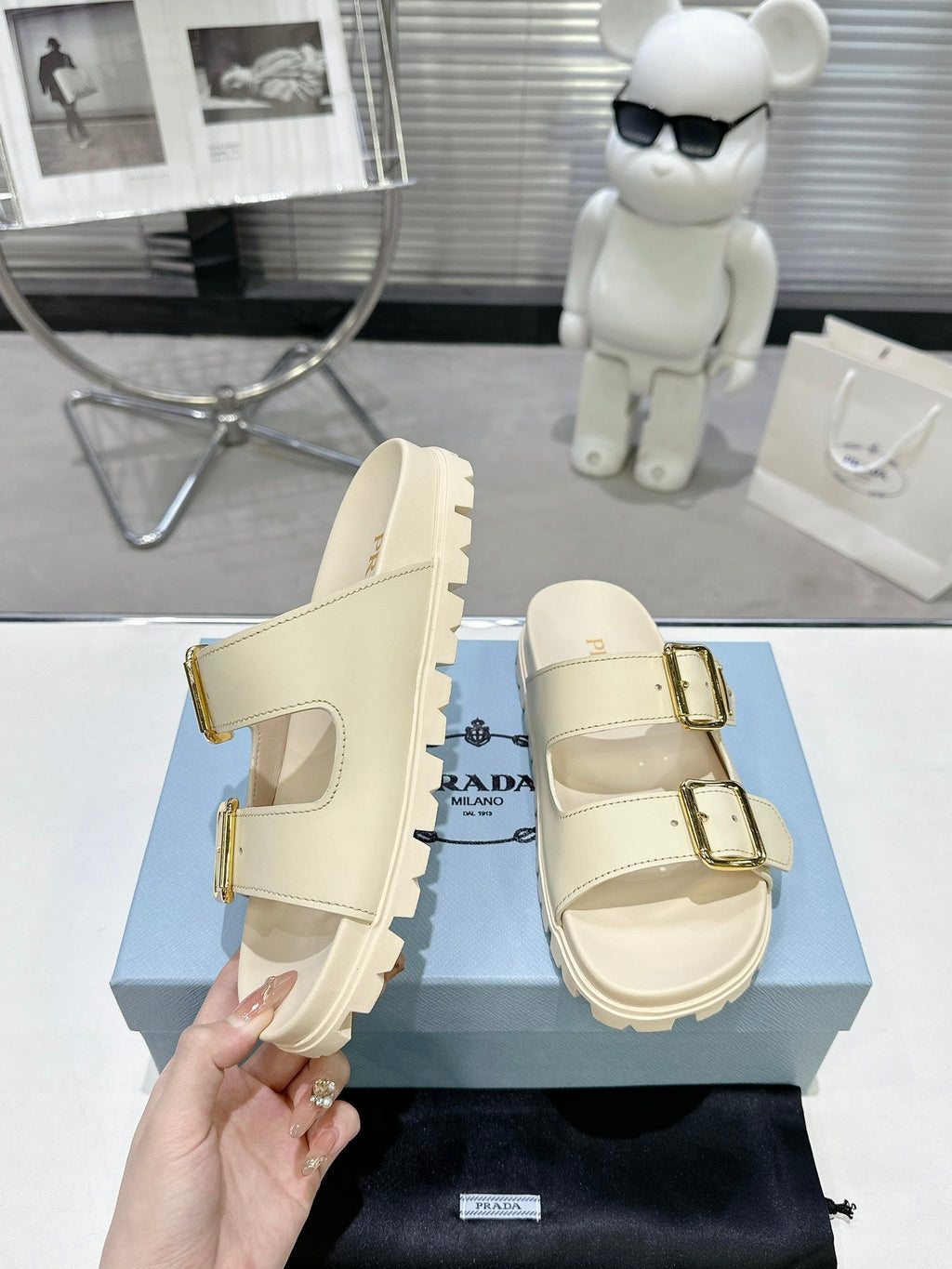 PRADA 25S STRAP SLIDES 30MM IN CREAM CALFSKIN GOLD HARDWARE