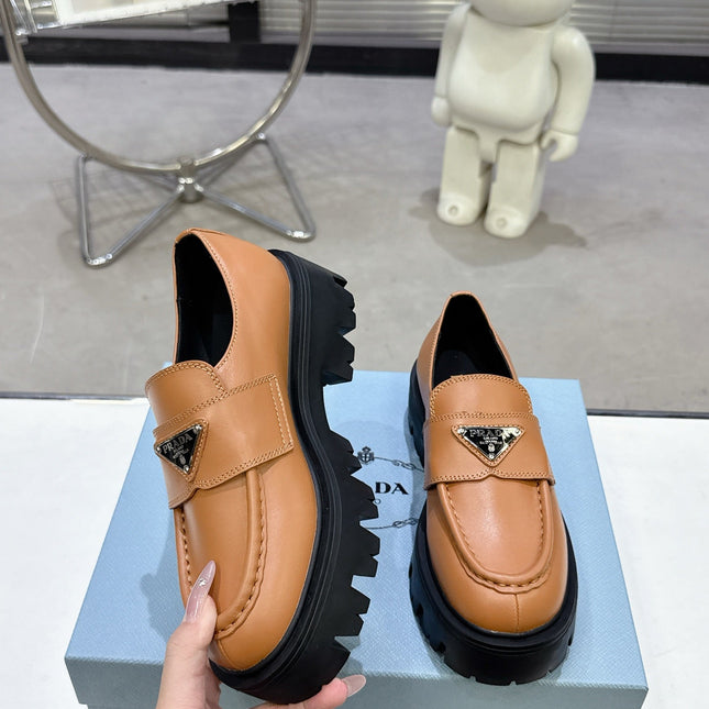 PRADA 25S THICK-SOLE LOAFERS 60 MM IN COGNAC BROWN CALFSKIN