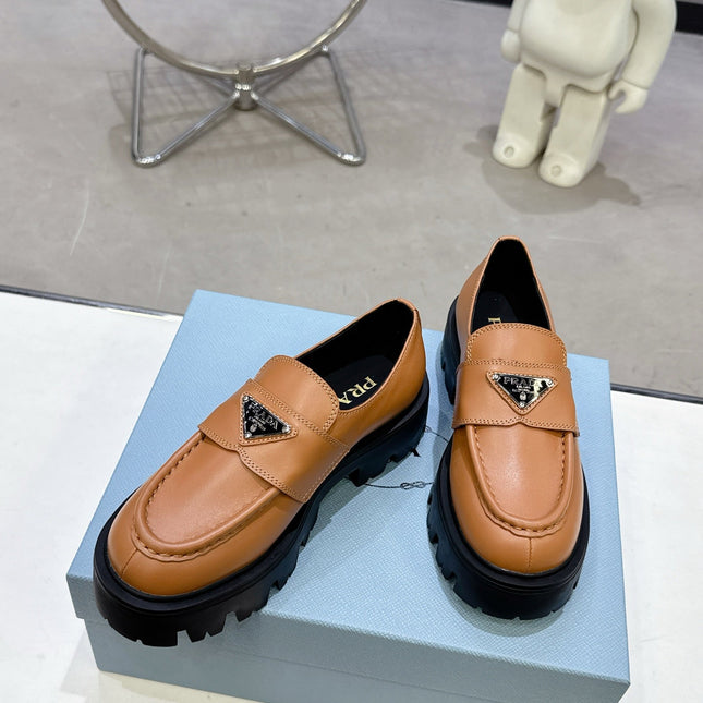 PRADA 25S THICK-SOLE LOAFERS 60 MM IN COGNAC BROWN CALFSKIN
