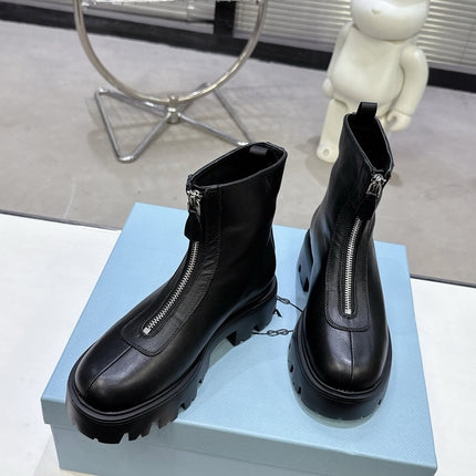 PRADA 25S ZIP-UP ANKLE BOOTS IN BLACK CALFSKIN