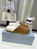 PRADA 25S FUR-LINED MULES IN BROWN SUEDE