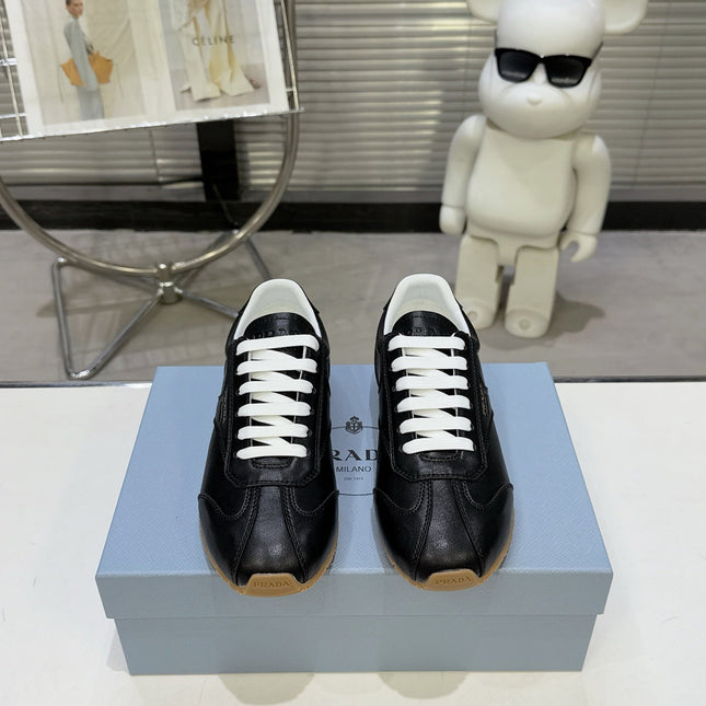 PRADA 26S LACE UP SNEAKERS IN BLACK CALFSKIN