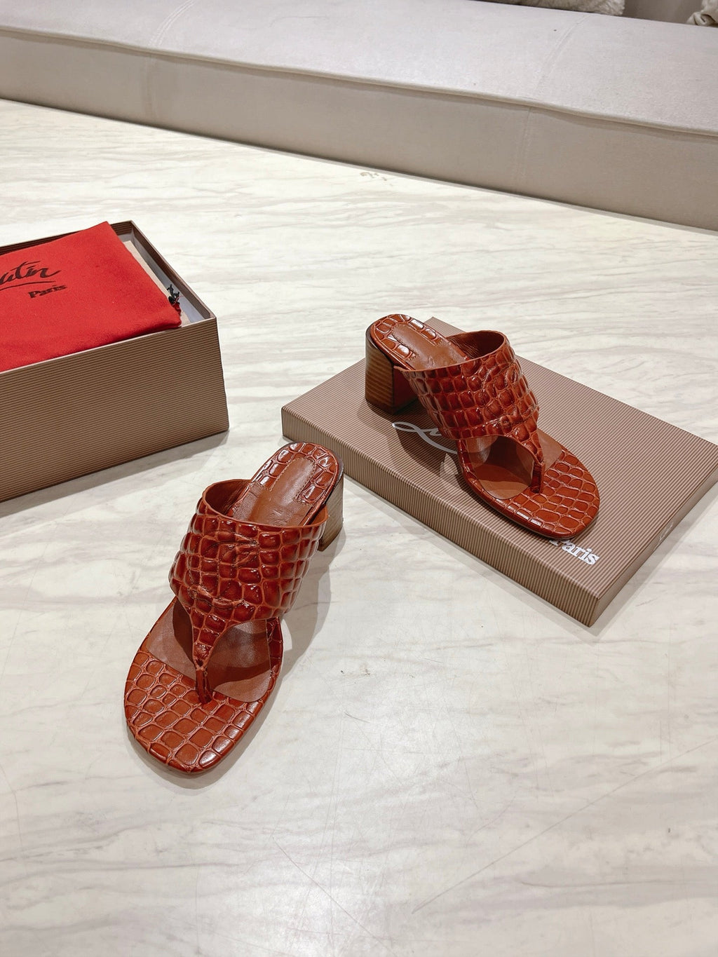 EMBOIDERED LOGO MULES IN COGNAC BROWN EMBOSSED CALFSKIN