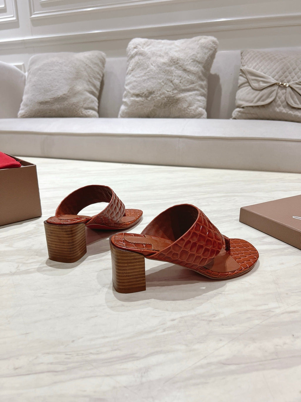 EMBOIDERED LOGO MULES IN COGNAC BROWN EMBOSSED CALFSKIN