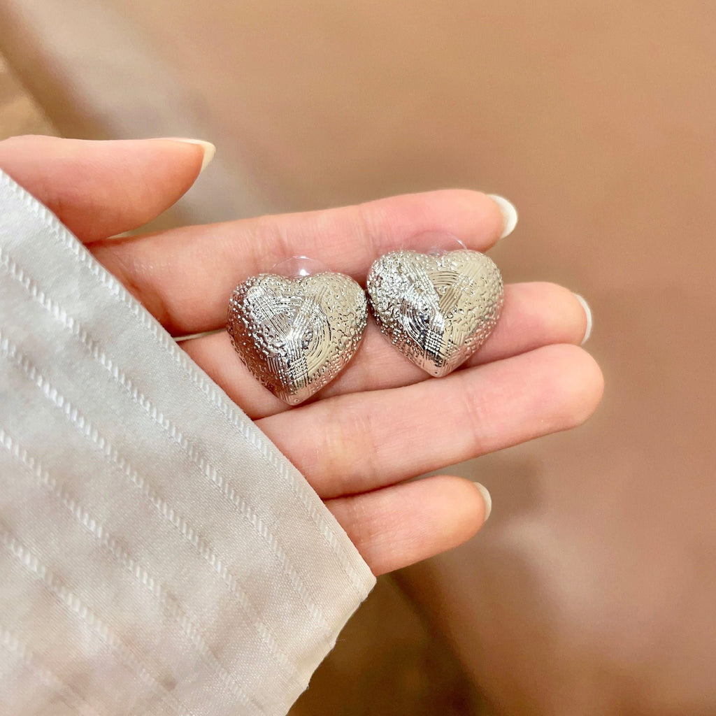 YSL 26S TEXTURED HEART STUD EARRINGS IN SILVER TONE METAL 622901
