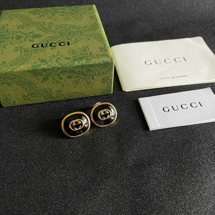 GUCCI 26S INTERLOCKING G ROUND LOGO STUD EARRINGS IN BLACK ENAMEL & GOLD TONE METAL 625716