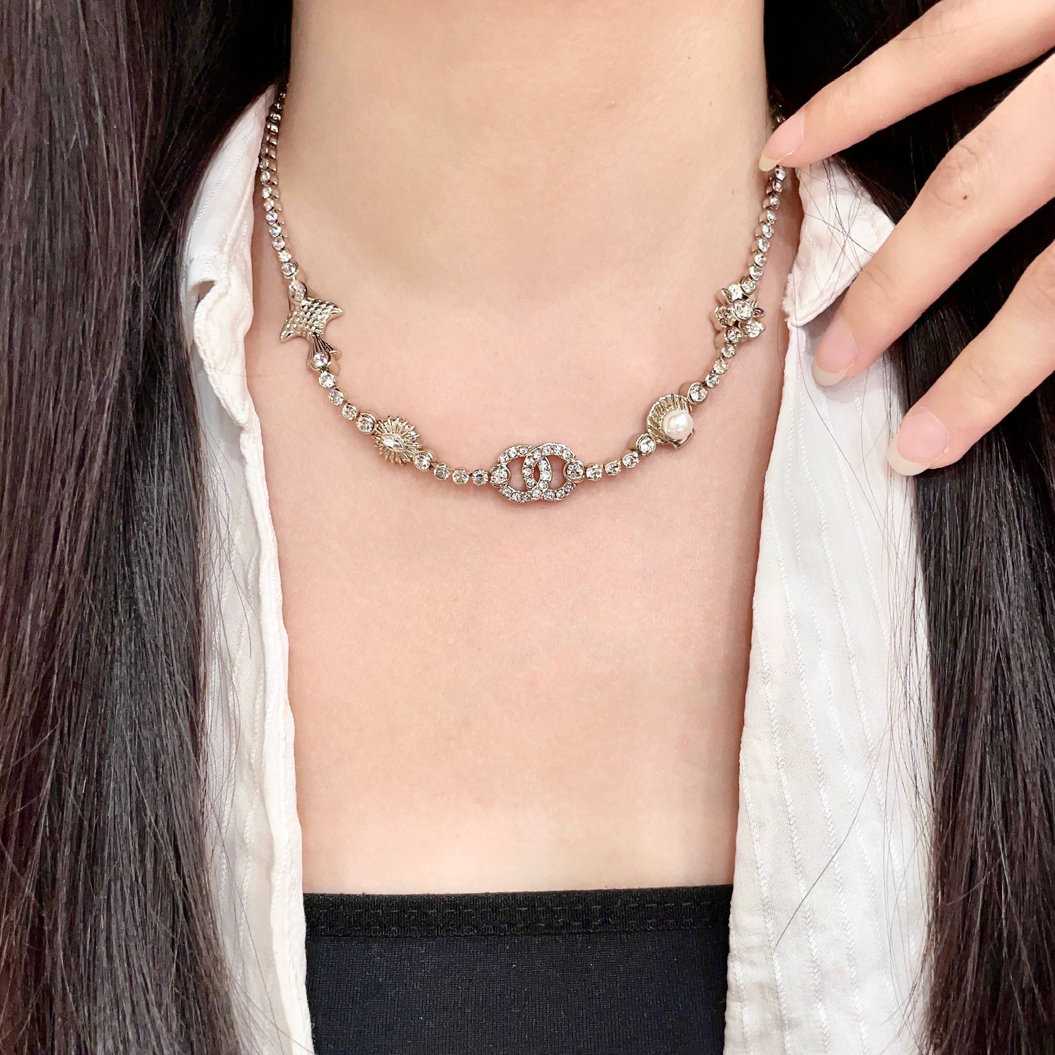 CHANEL 26S DOUBLE C LOGO CRYSTAL MULTI-CHARM STATEMENT BRACELET IN GOLD METAL 629170