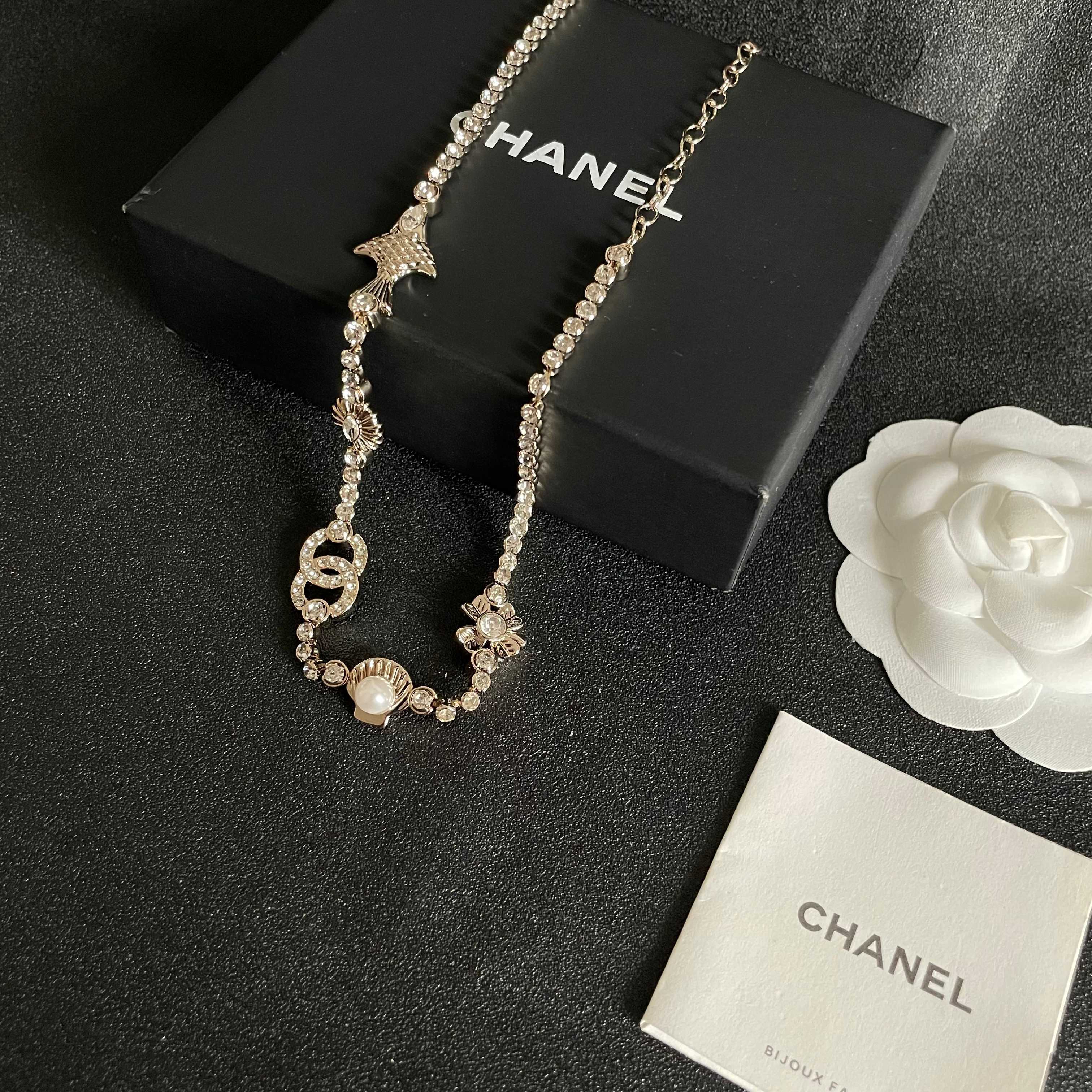 CHANEL 26S DOUBLE C LOGO CRYSTAL MULTI-CHARM STATEMENT BRACELET IN GOLD METAL 629170