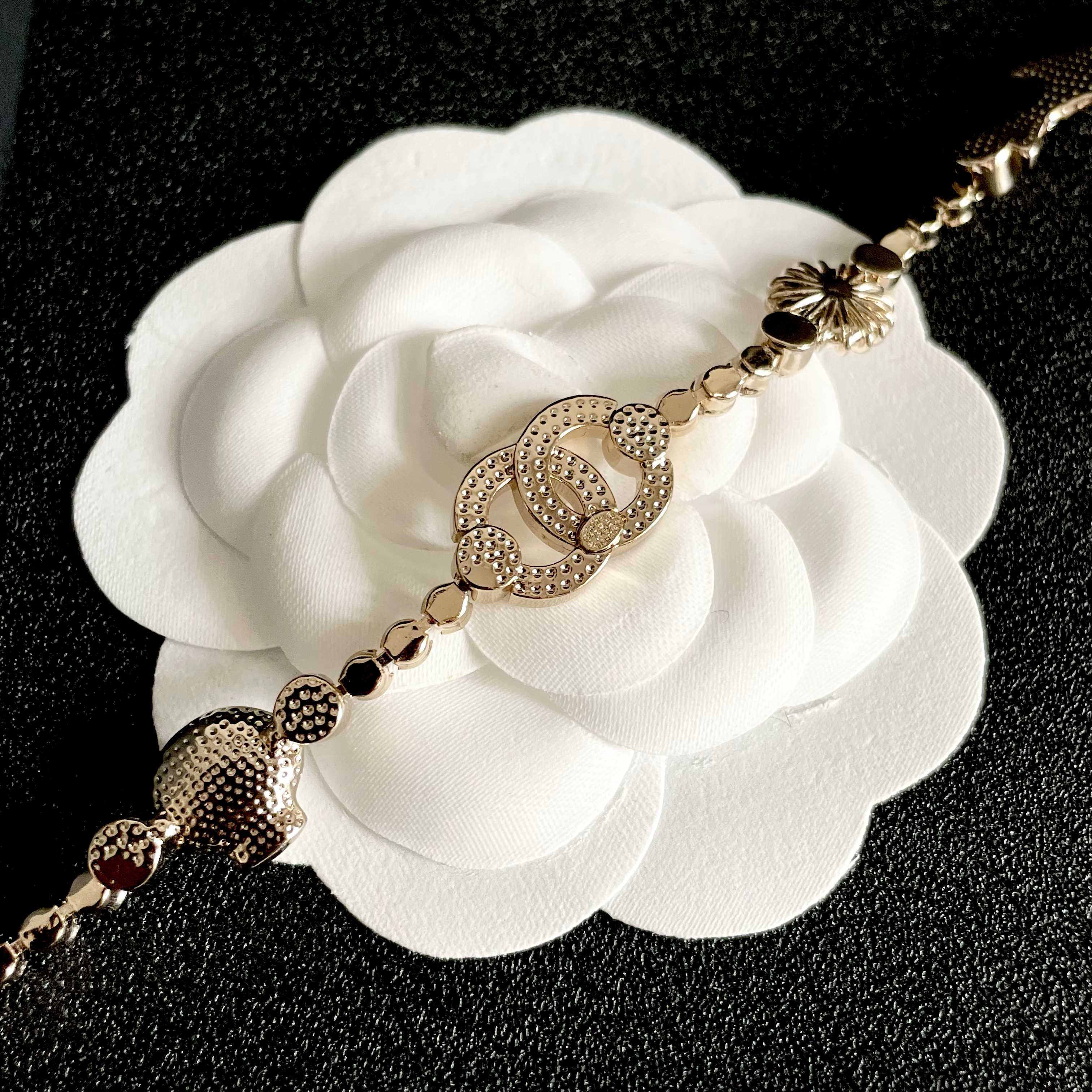 CHANEL 26S DOUBLE C LOGO CRYSTAL MULTI-CHARM STATEMENT BRACELET IN GOLD METAL 629170