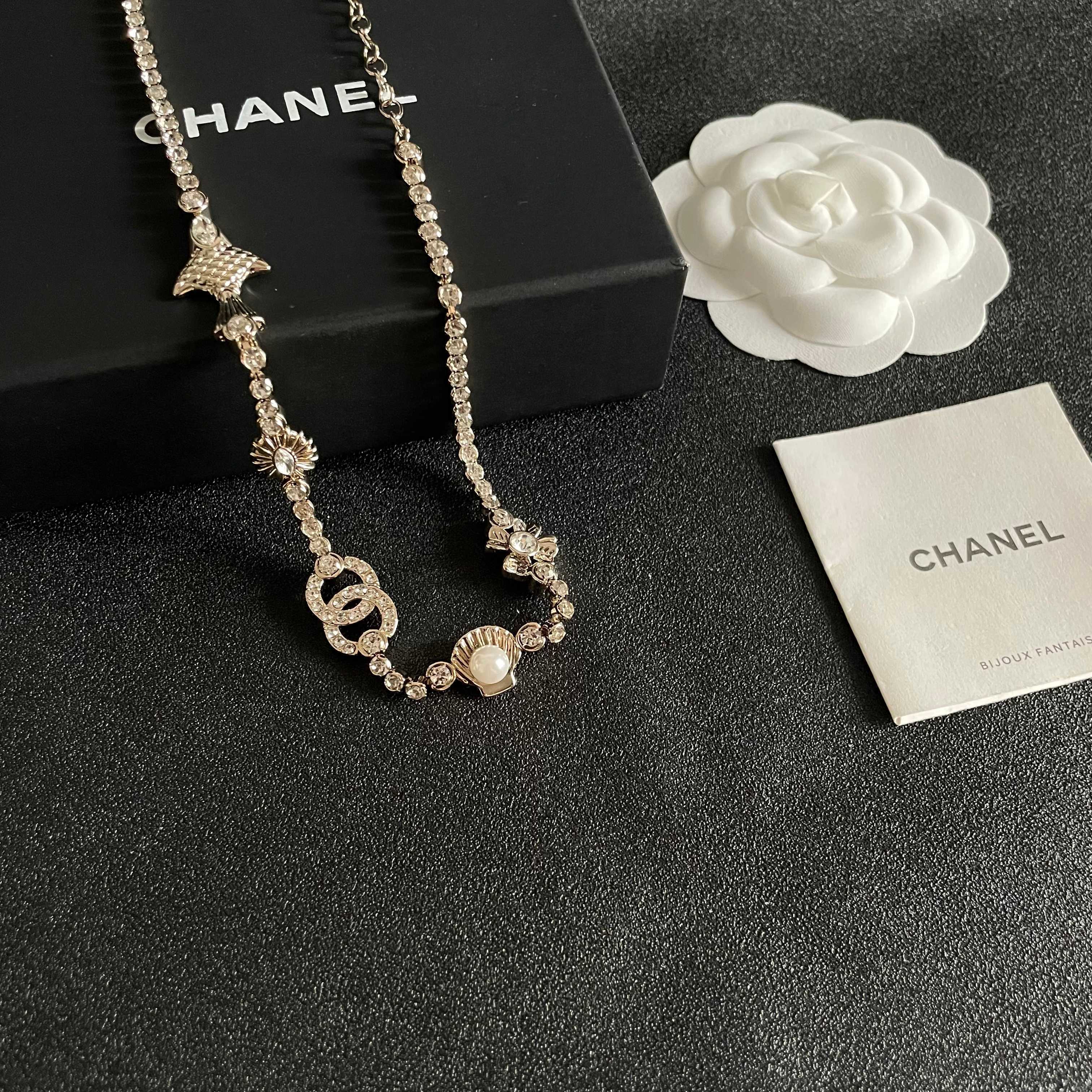 CHANEL 26S DOUBLE C LOGO CRYSTAL MULTI-CHARM STATEMENT BRACELET IN GOLD METAL 629170