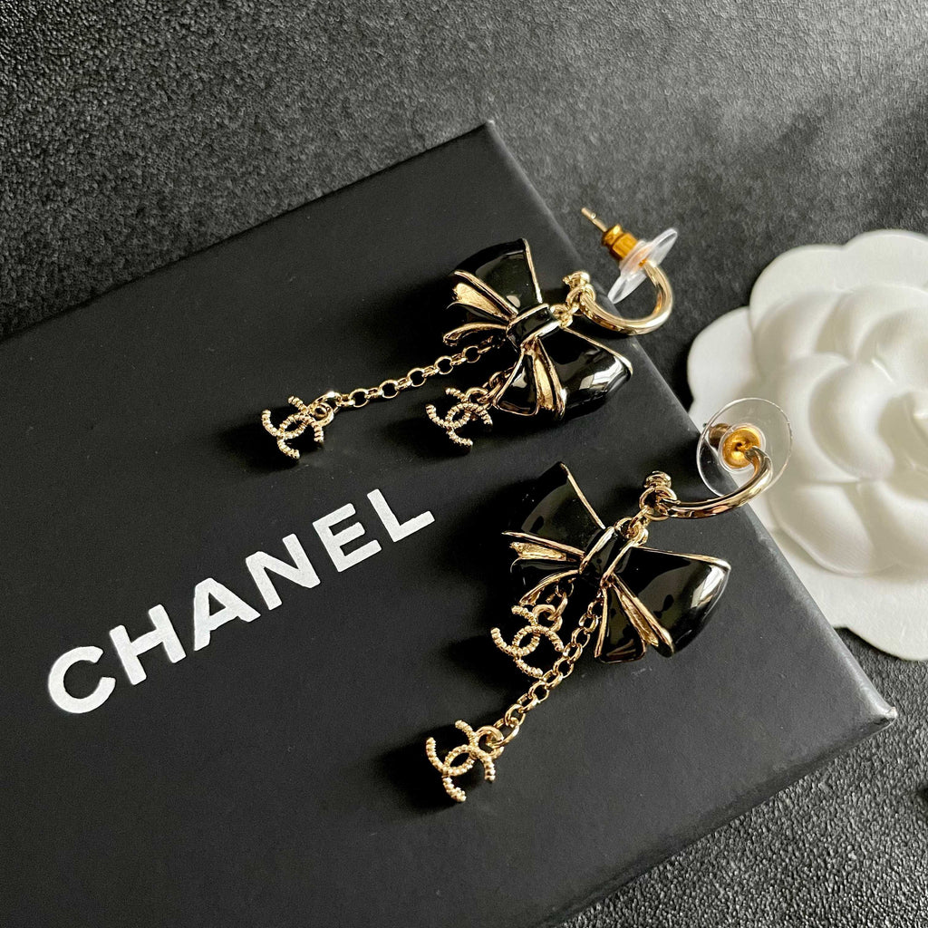 CHANEL 26S DOUBLE C LOGO BLACK ENAMEL BOW DANGLE EARRINGS WITH CHAIN CHARMS IN GOLD METAL 629178