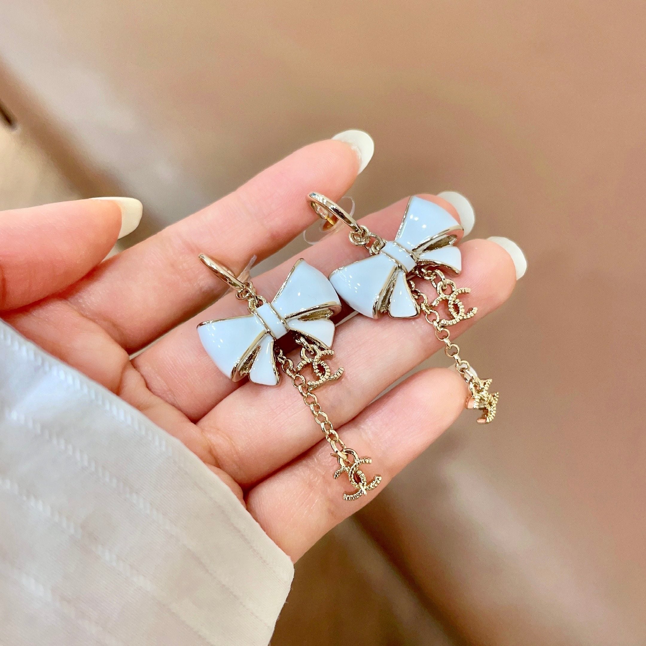 CHANEL 26S DOUBLE C LOGO WHITE ENAMEL BOW & CHAIN DROP HOOP EARRINGS IN GOLD METAL 629182
