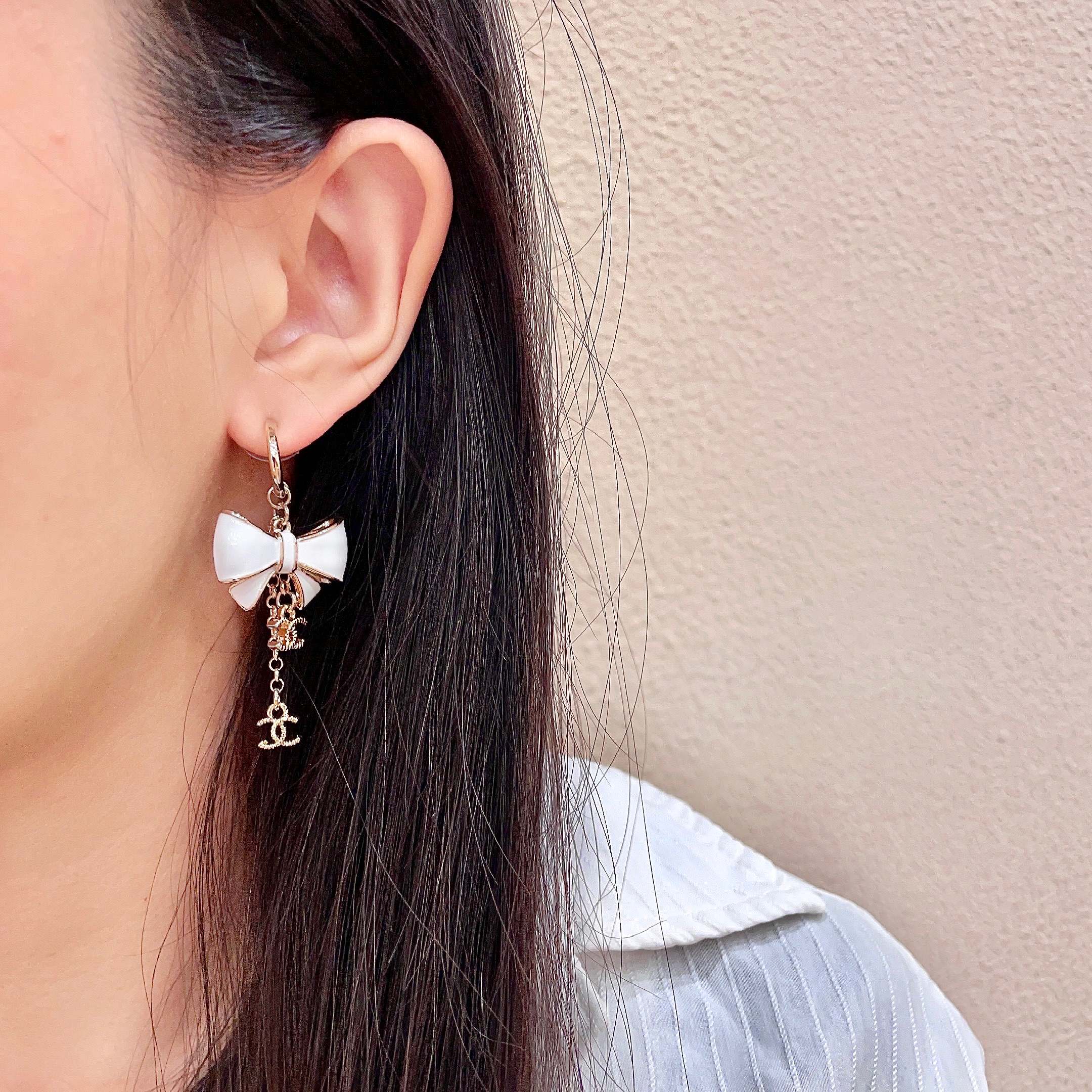 CHANEL 26S DOUBLE C LOGO WHITE ENAMEL BOW & CHAIN DROP HOOP EARRINGS IN GOLD METAL 629182