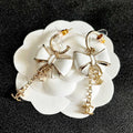 CHANEL 26S DOUBLE C LOGO WHITE ENAMEL BOW & CHAIN DROP HOOP EARRINGS IN GOLD METAL 629182