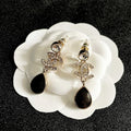 CHANEL 26S DOUBLE C LOGO CRYSTAL & BROWWN TEARDROP DANGLE EARRINGS IN GOLD METAL 629180