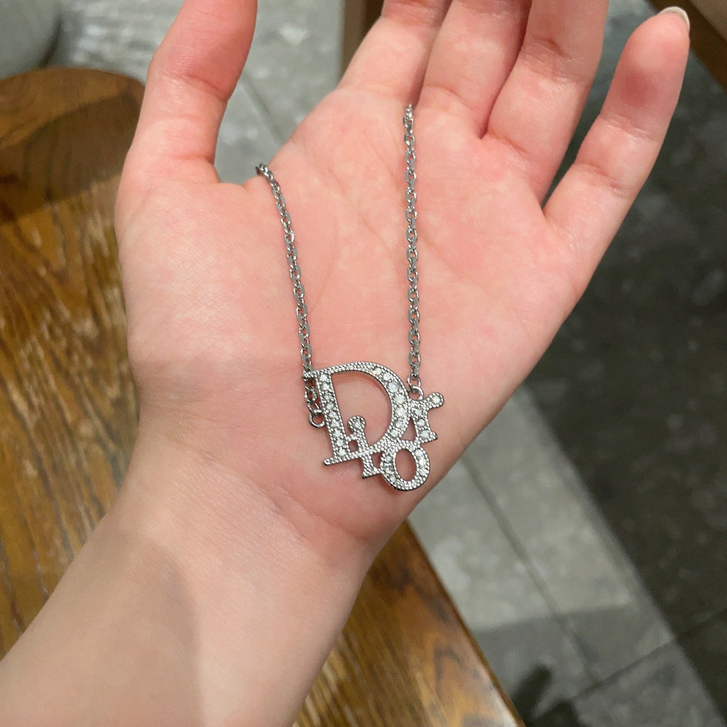 CD 26S CRYSTAL DIOR LOGO PENDANT NECKLACE IN SILVER METAL 631900