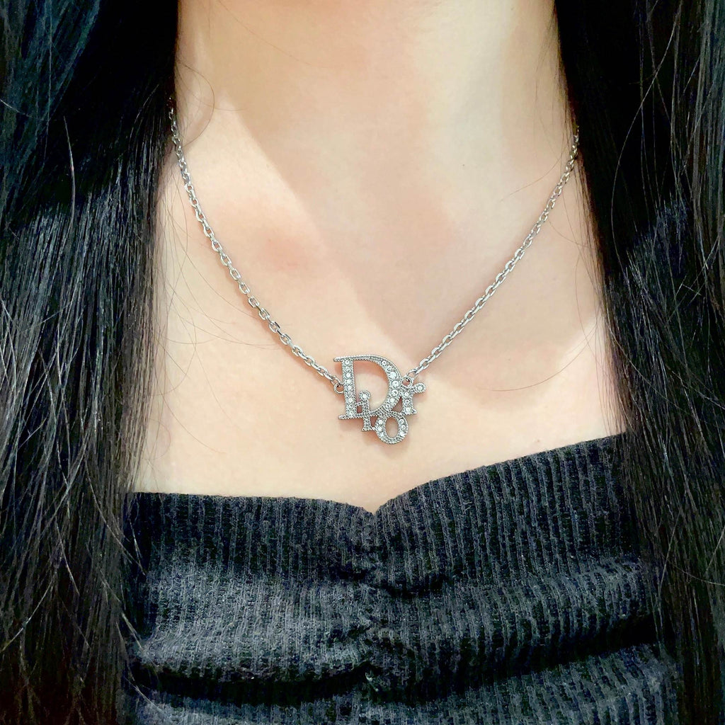 CD 26S CRYSTAL DIOR LOGO PENDANT NECKLACE IN SILVER METAL 631900