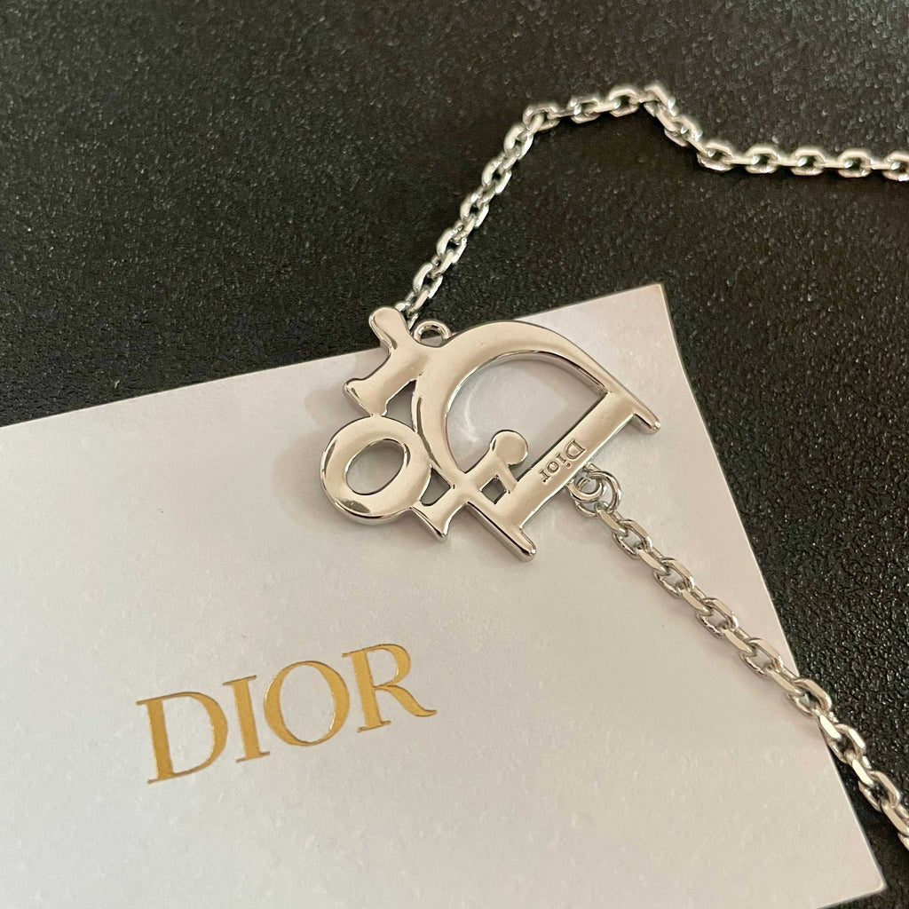 CD 26S CRYSTAL DIOR LOGO PENDANT NECKLACE IN SILVER METAL 631900
