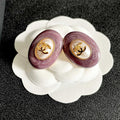 CHANEL 26S DOUBLE C LOGO PURPLE ENAMEL PEARL OVAL STUD EARRINGS IN GOLD METAL 629154