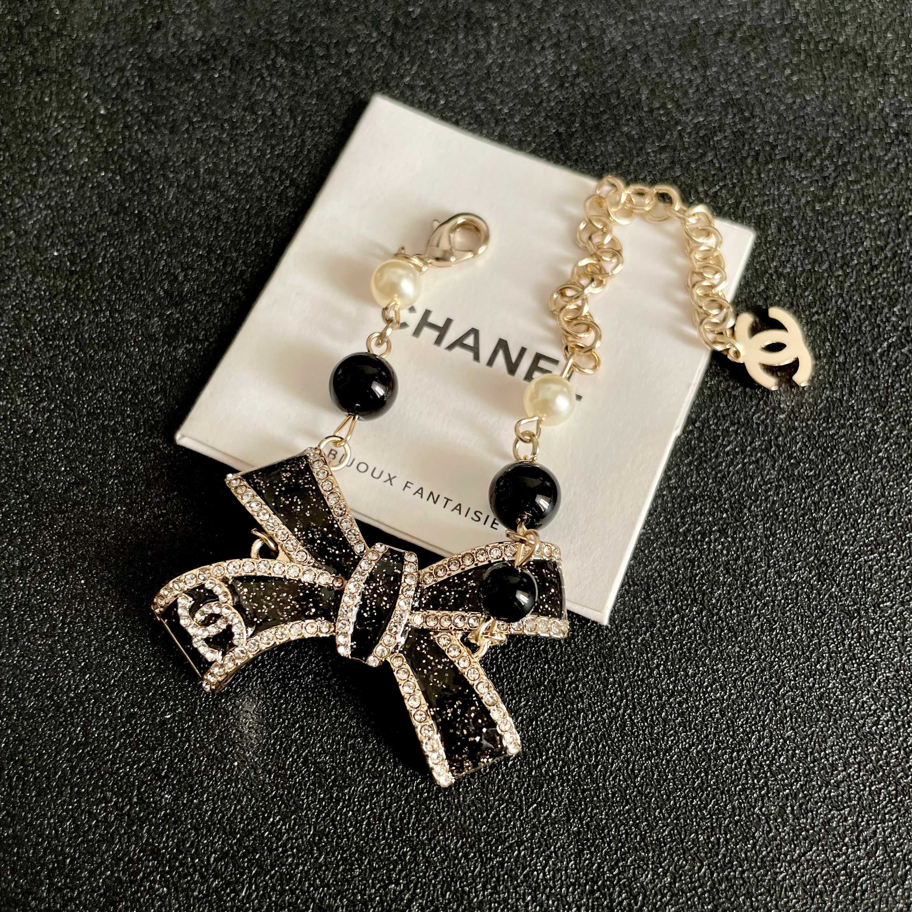 CHANEL 26S CRYSTAL BOW PEARL & BEAD CHAIN BRACELET IN GOLD METAL 629979