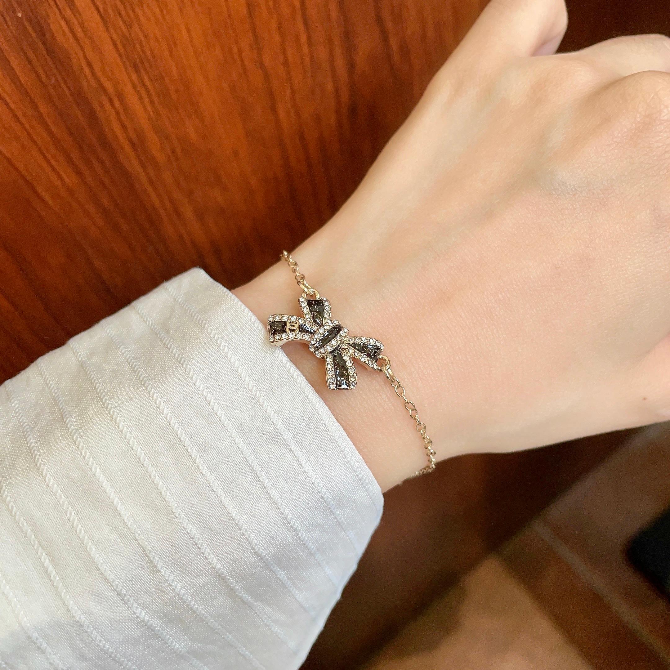 CHANEL 26S CRYSTAL BOW CHAIN BRACELET IN GOLD METAL 629980