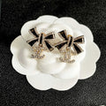CHANEL 26S DOUBLE C LOGO CRYSTAL BOW DROP EARRINGS IN GOLD METAL 629981