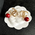 CHANEL 26S DOUBLE C LOGO CRYSTAL & RED BEAD DROP EARRINGS IN GOLD METAL 629983