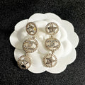 CHANEL 26S DOUBLE C LOGO CRYSTAL STAR DROP DANGLE EARRINGS IN GOLD METAL 629988
