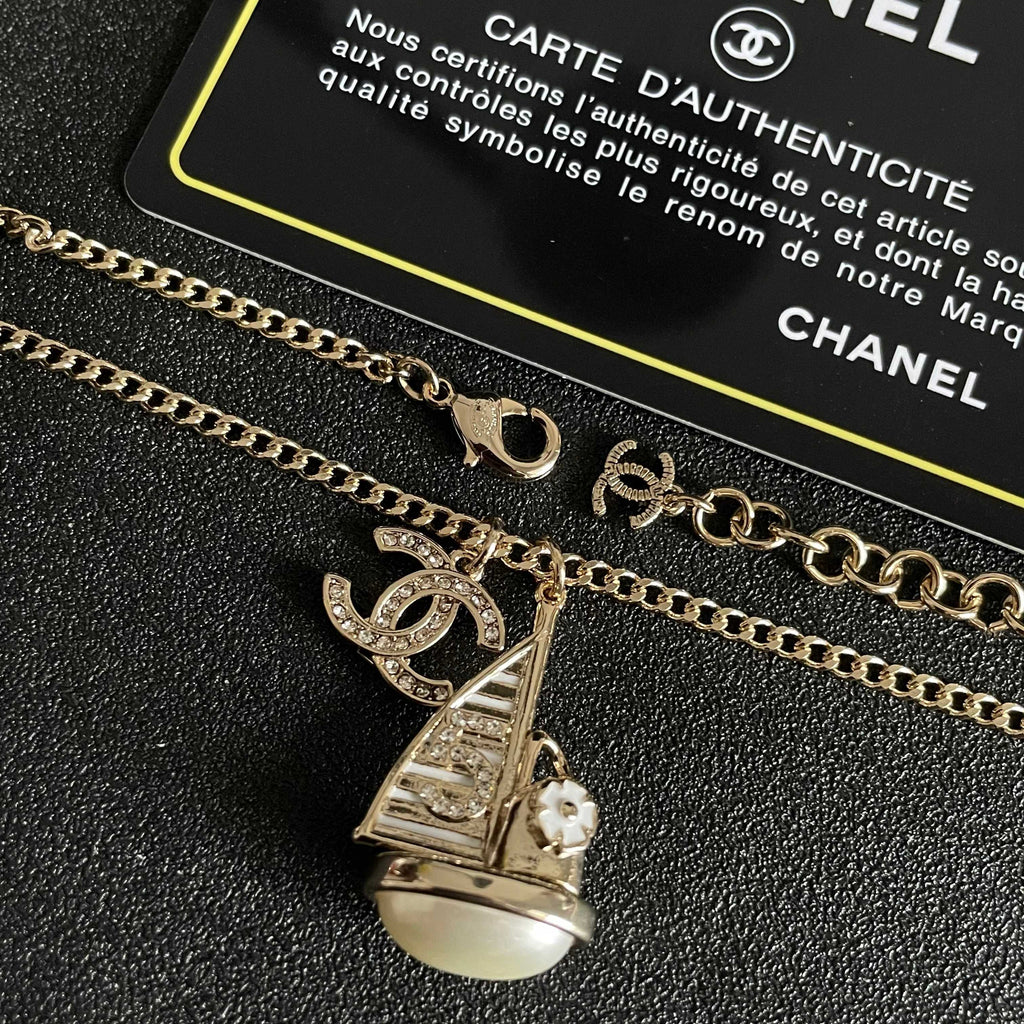 CHANEL 26S DOUBLE C LOGO SAILBOAT PENDANT NECKLACE WITH PEARL IN GOLD METAL 630060