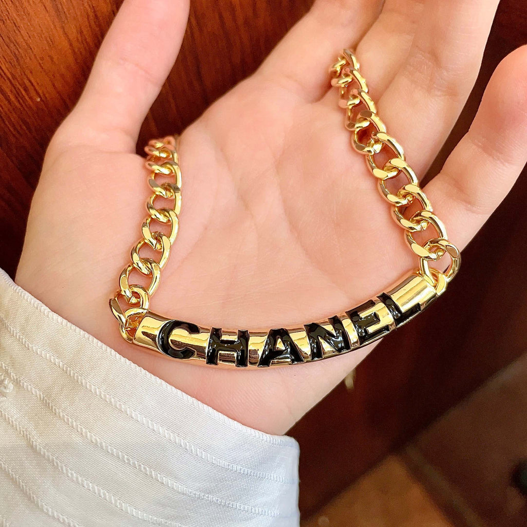 CHANEL 26S CHANEL BLACK LETTER LOGO CHAIN NECKLACE IN GOLD METAL 630061