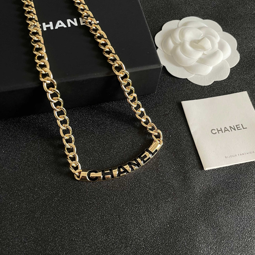 CHANEL 26S CHANEL BLACK LETTER LOGO CHAIN NECKLACE IN GOLD METAL 630061