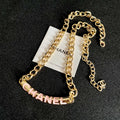 CHANEL 26S CHANEL LETTER LOGO ENAMEL CHAIN NECKLACE IN GOLD METAL WITH CC CHARM 630062