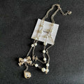 CHANEL 26S DOUBLE C LOGO PEARL LAYERED CHAIN BOW & CRYSTAL DROP NECKLACE IN GOLD METAL 629883