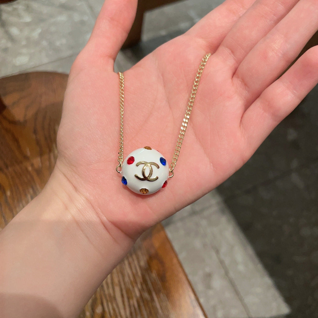 CHANEL 26S DOUBLE C LOGO WHITE ENAMEL CRYSTAL BALL PENDANT NECKLACE IN GOLD METAL 629889