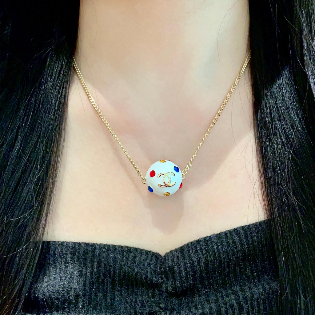 CHANEL 26S DOUBLE C LOGO WHITE ENAMEL CRYSTAL BALL PENDANT NECKLACE IN GOLD METAL 629889