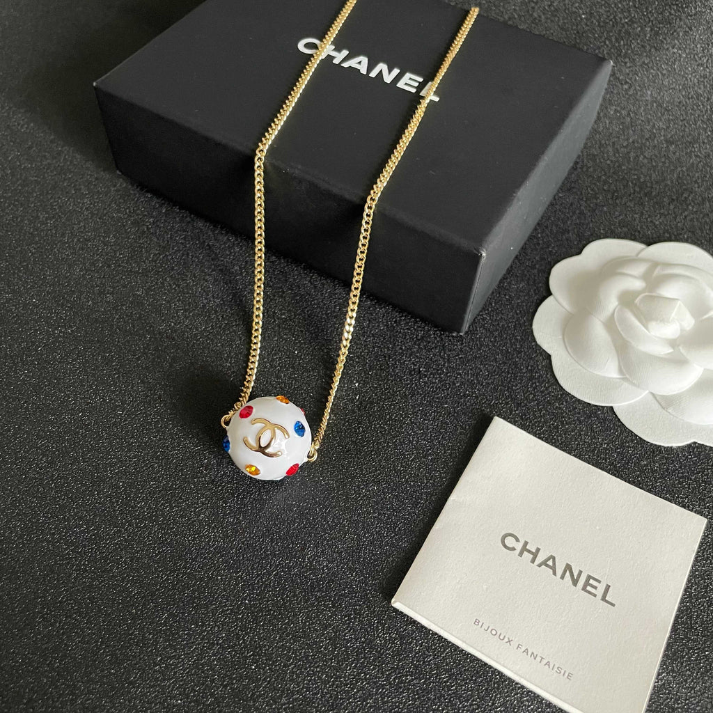 CHANEL 26S DOUBLE C LOGO WHITE ENAMEL CRYSTAL BALL PENDANT NECKLACE IN GOLD METAL 629889