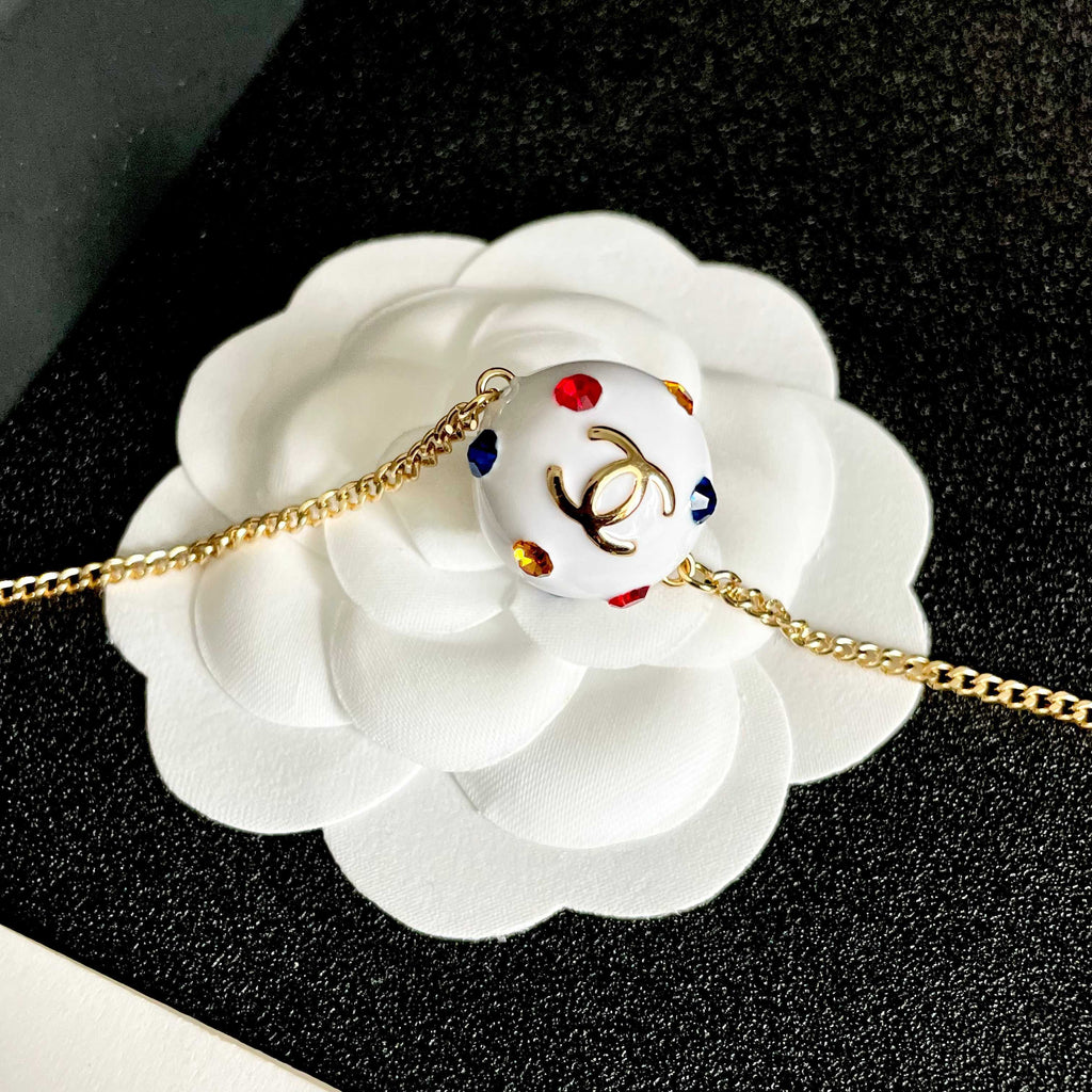 CHANEL 26S DOUBLE C LOGO WHITE ENAMEL CRYSTAL BALL PENDANT NECKLACE IN GOLD METAL 629889