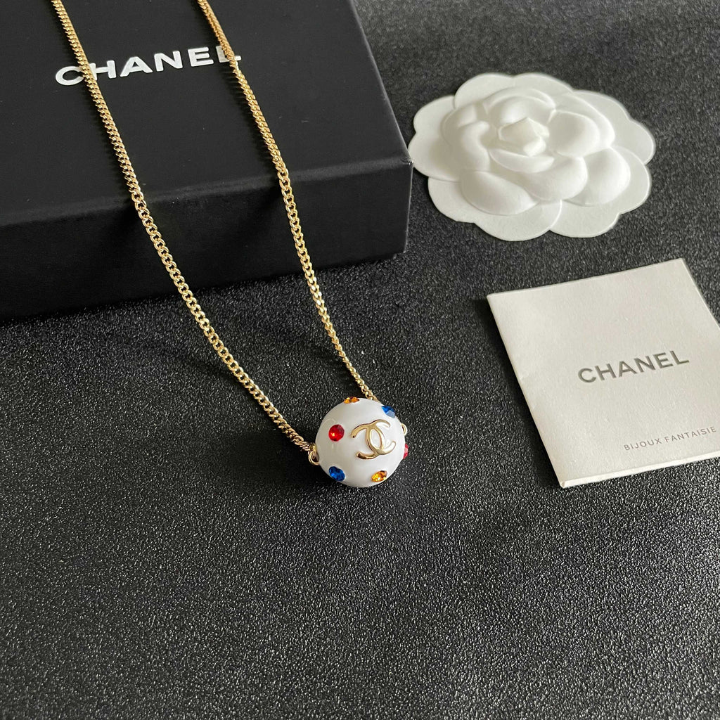 CHANEL 26S DOUBLE C LOGO WHITE ENAMEL CRYSTAL BALL PENDANT NECKLACE IN GOLD METAL 629889