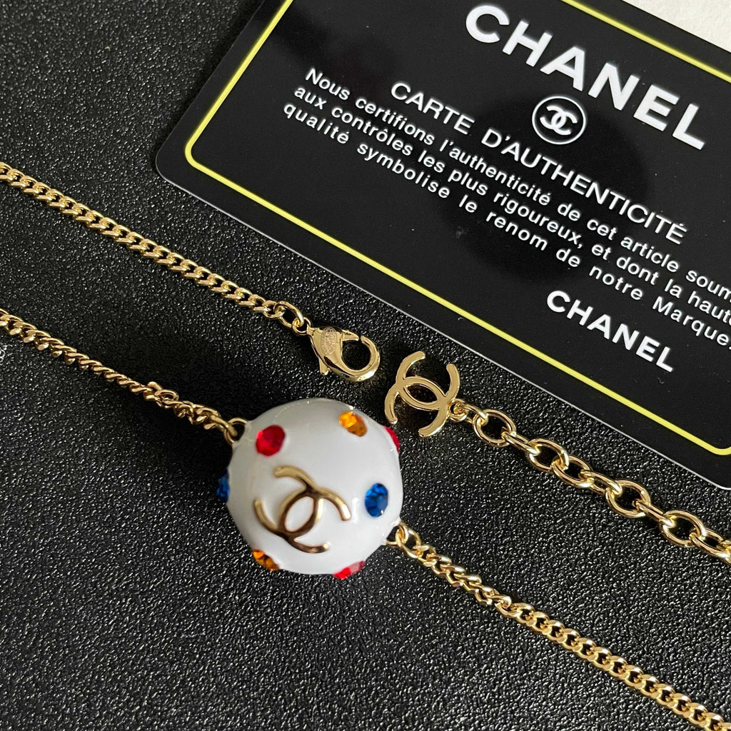CHANEL 26S DOUBLE C LOGO WHITE ENAMEL CRYSTAL BALL PENDANT NECKLACE IN GOLD METAL 629889
