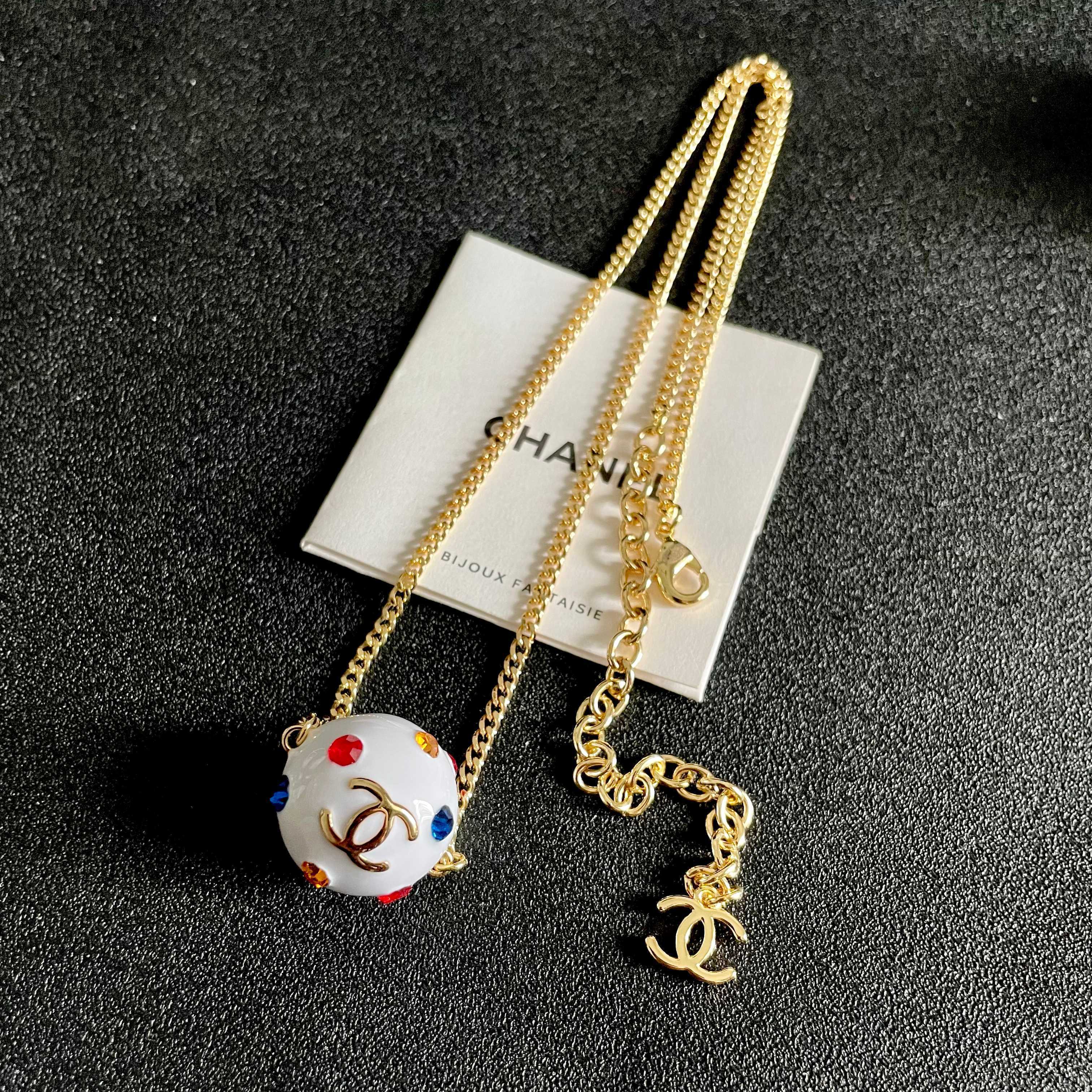 CHANEL 26S DOUBLE C LOGO WHITE ENAMEL CRYSTAL BALL PENDANT NECKLACE IN GOLD METAL 629889