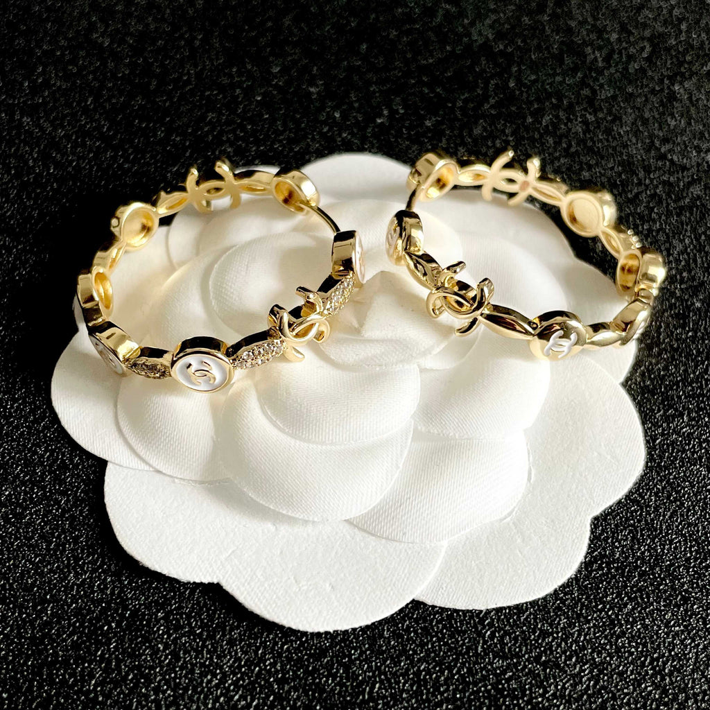 CHANEL 26S DOUBLE C LOGO WHITE ENAMEL & CRYSTAL LINK HOOP EARRINGS IN GOLD METAL 629898